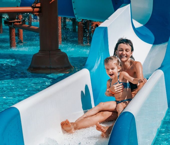 Mother and child on a water slide