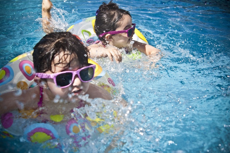 Small kids swimming on a pool