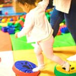 Little girl playing on an indoor soft play facility