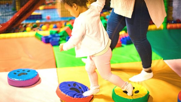 Little girl playing on an indoor soft play facility